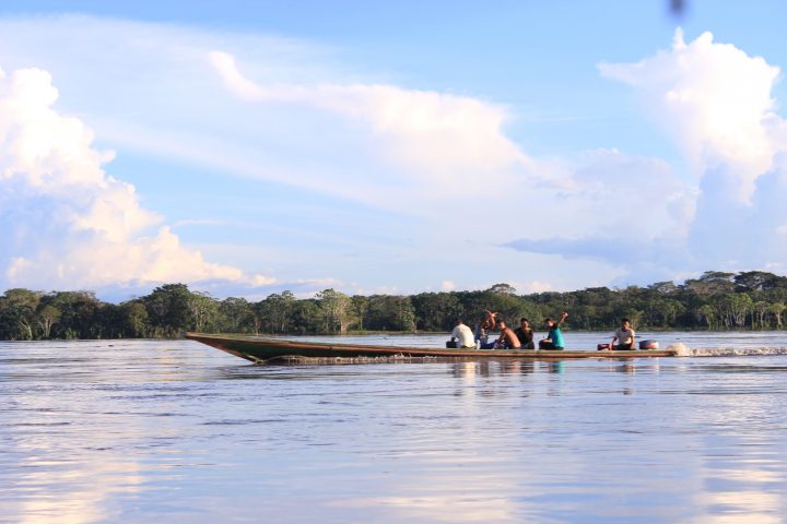 Friendly people riding a boat