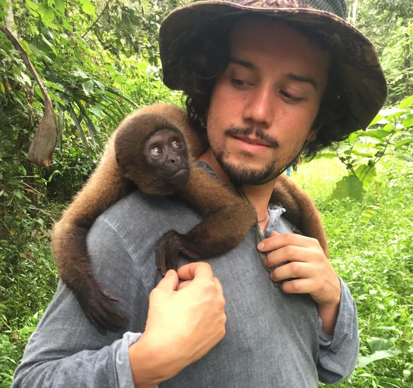 Monkey playing with visitor at Monkey Island