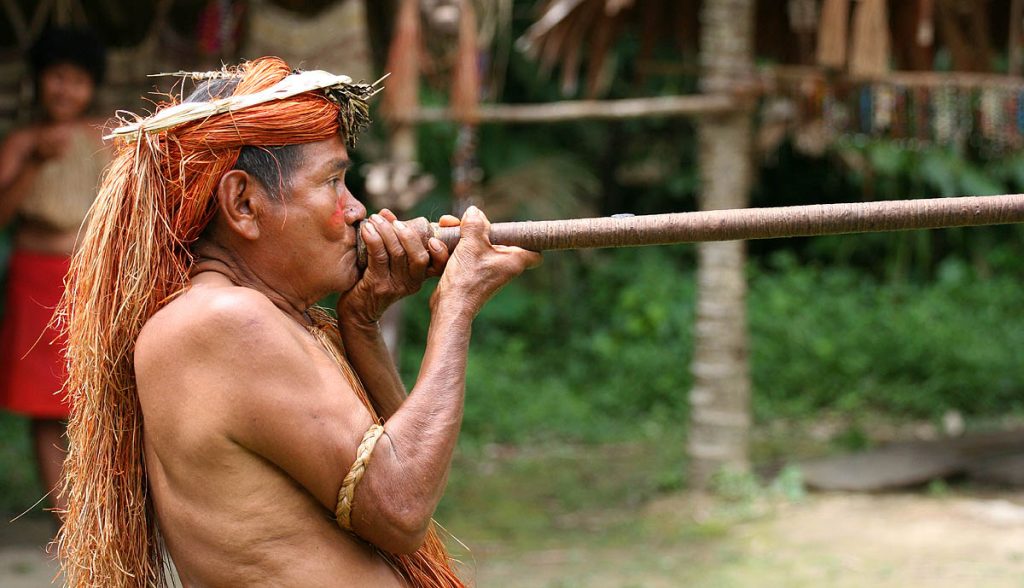 Yagua tribe member using a blowgun